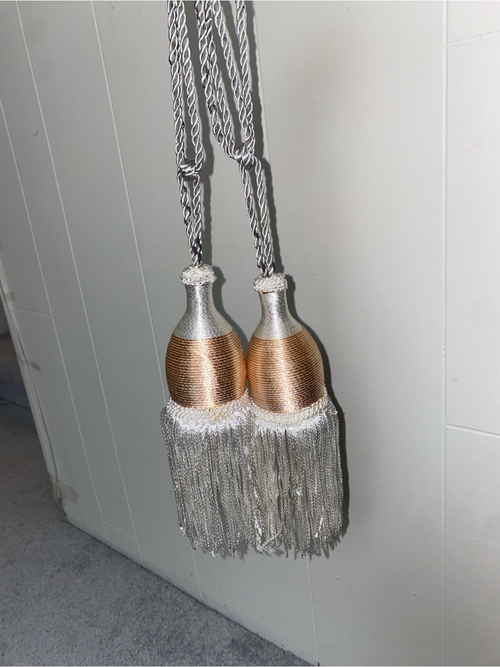 decorative silver and bronze-toned double rope curtain tieback tassels